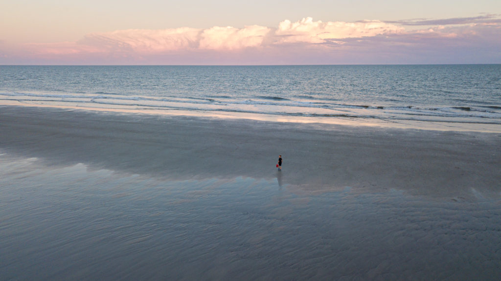 A boy on a beach  on a Hilton Head family vacation.