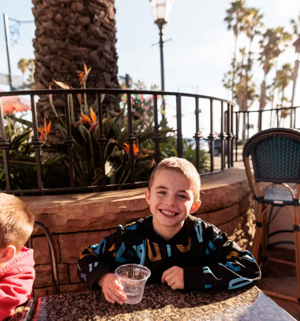 Two boys sitting at a table. Breakfast in Santa Barbara with kids