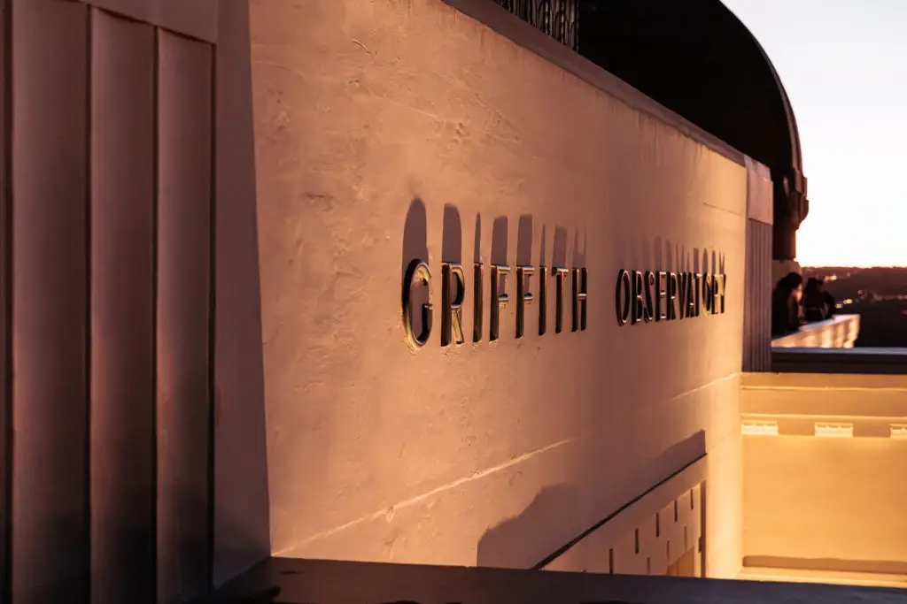 A building with a sign that says griffith observatory.  Highlights from our time on State Street! Griffith Observatory with kids.