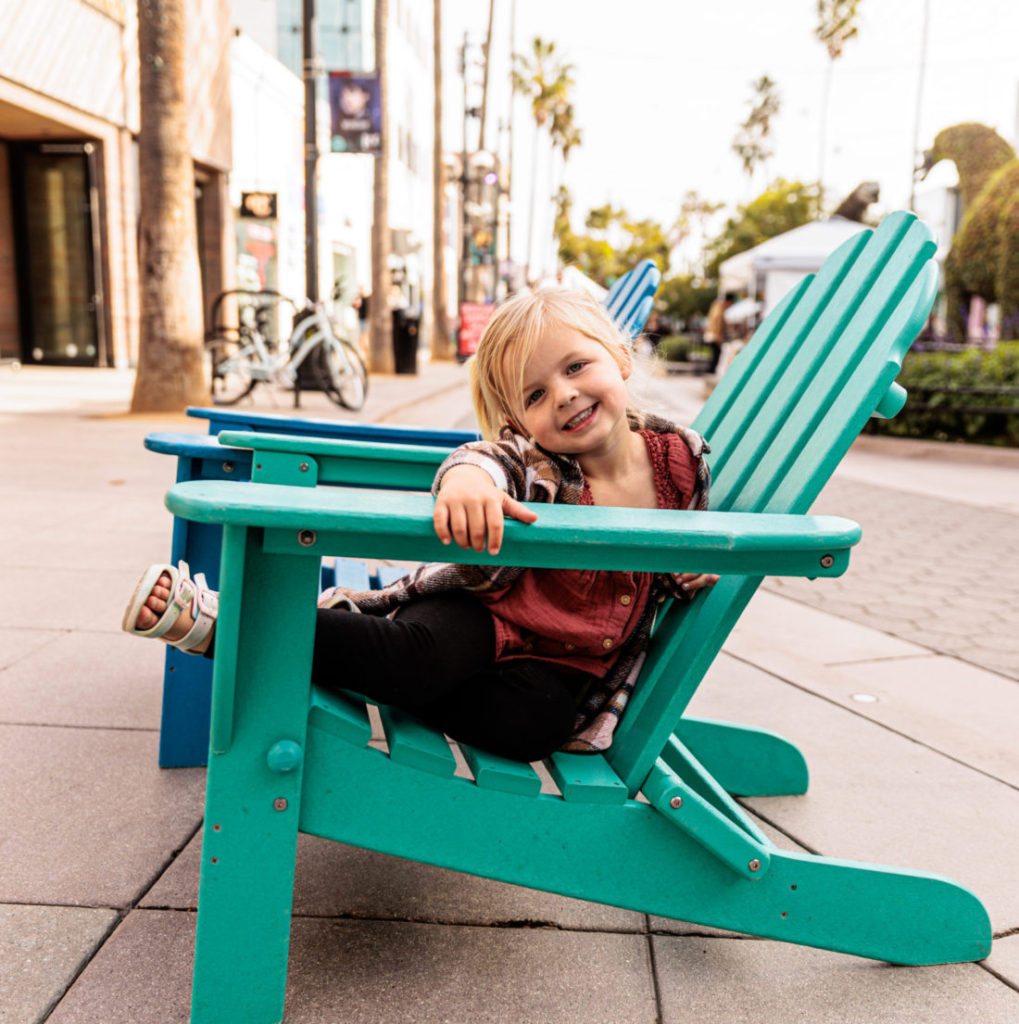 A girl sitting in a chair.