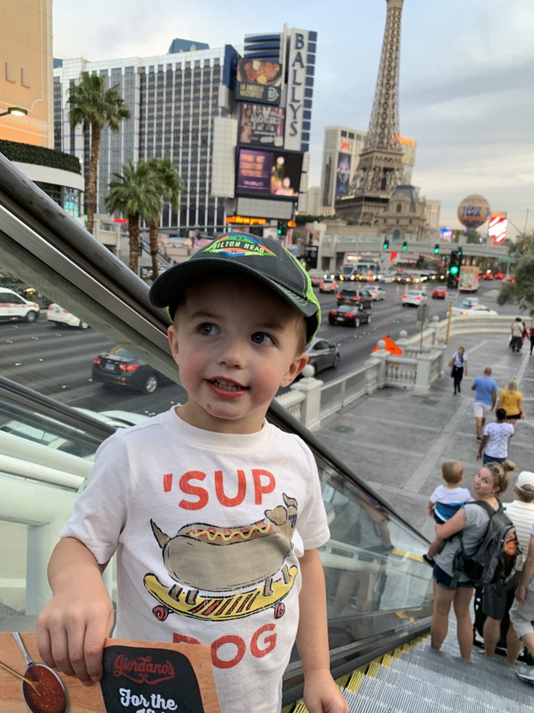 A young boy enjoying a family adventure on an escalator in Las Vegas.