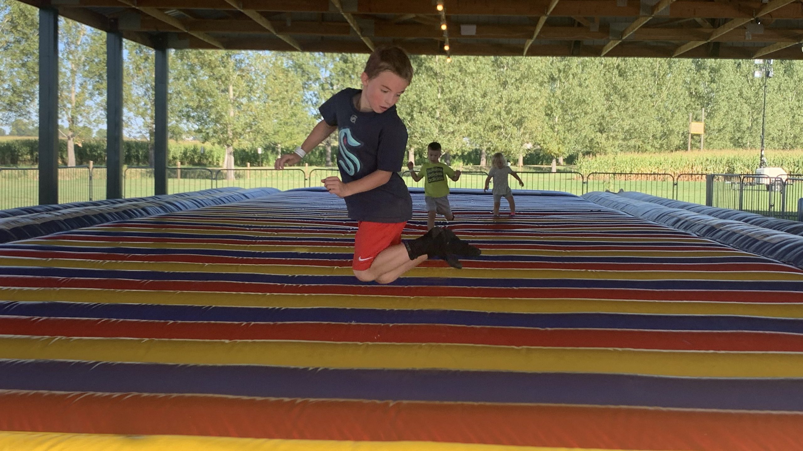 boy, inflatable, at pumpkin patch in Colorado