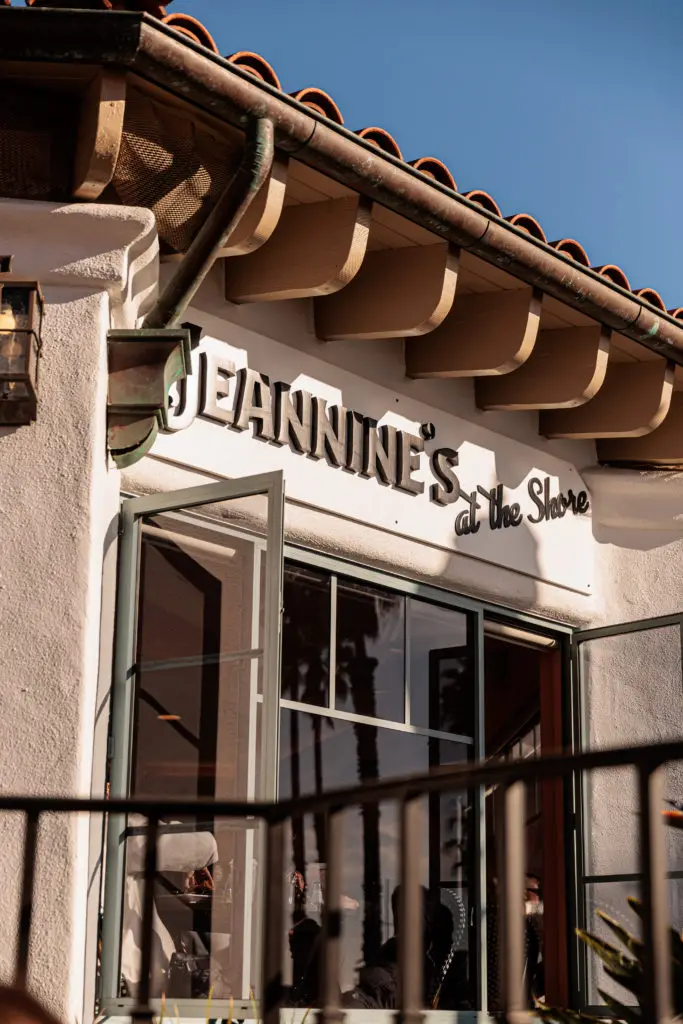 A building with a sign that says jennine's and the shop. Breakfast in Santa Barbara with kids.