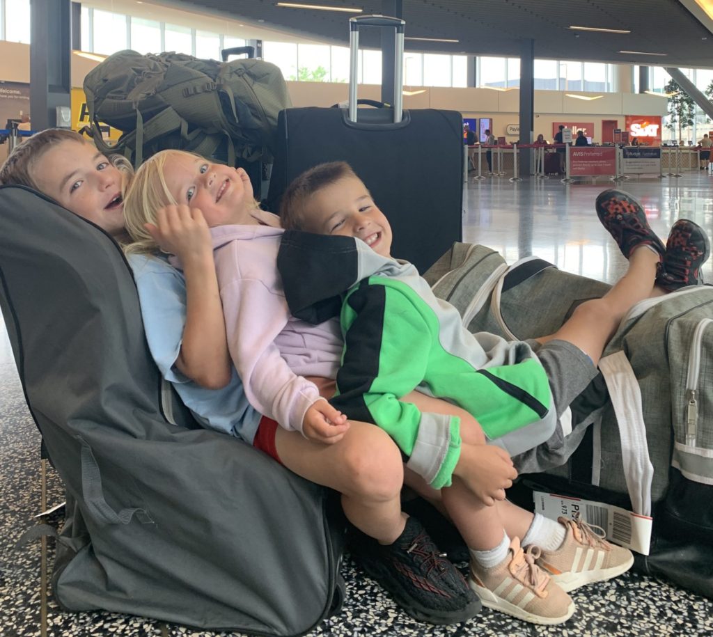 A group of kids in an airport.  Is Clear worth it for families.