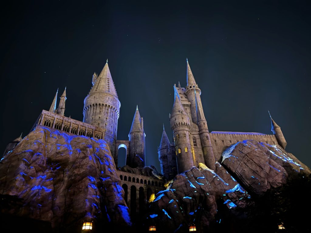 Hogwarts castle lit up at night. Universal Studios Hollywood with Kids