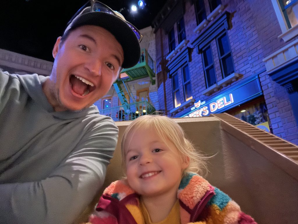 A dad and daughter taking a selfie at Pets. Universal Studios Hollywood with Kids