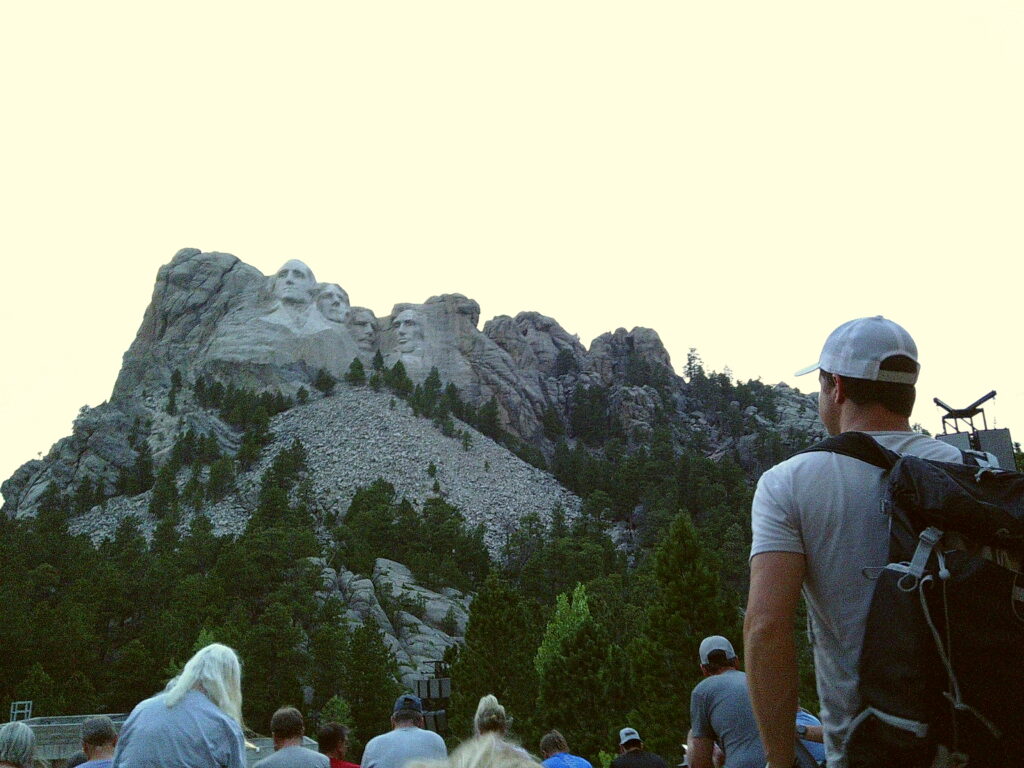 People gather near Mount Rushmore, which features four presidential sculptures carved into the mountainside.  Camp Snap Discount Code