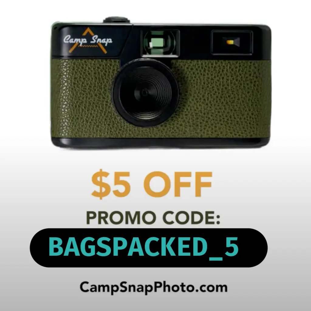 Vintage camera with a green textured surface. Unlock a Camp Snap discount code and get $5 OFF. PROMO CODE: BAGSPACKED_5 at CampSnapPhoto.com.